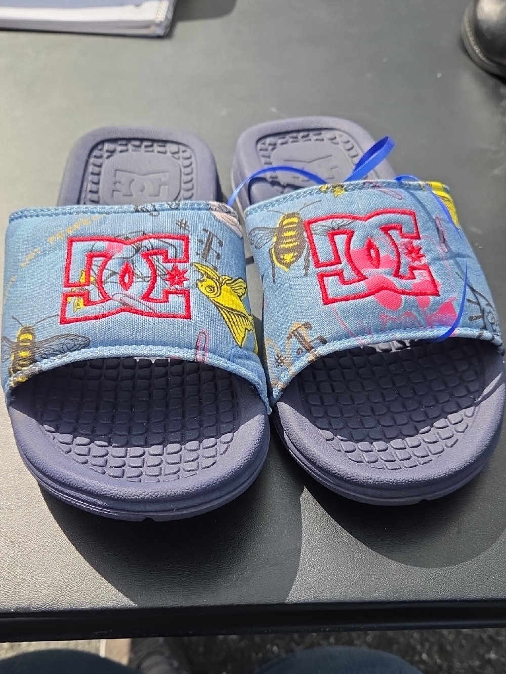 DC Kids Blue Slide Sandals with Red Logo and Yellow Accent
